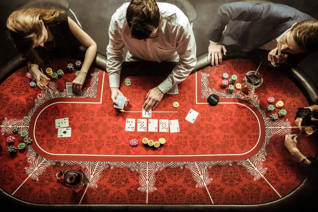 top view of men and women playing poker in casino 2021 08 29 10 17 03 utc